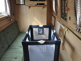 A travel cot on a  canal boat